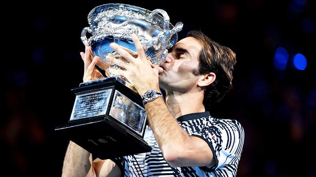 Roger Federer of Switzerland celebrates his win in the Mens Singles Final against Rafael Nadal of Spain on day fourteen of the Australian Open, in Melbourne, Australia, Sunday Jan. 29, 2017. (AAP Image/Lukas Coch) NO ARCHIVING, EDITORIAL USE ONLY