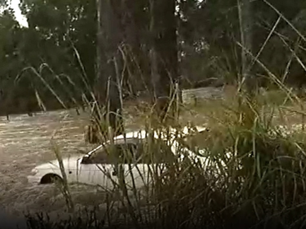 An 85-year-old woman was rescued by police after her vehicle was swept off a flooded causeway at Bauple on the Fraser Coast. Picture: Qld Police Service