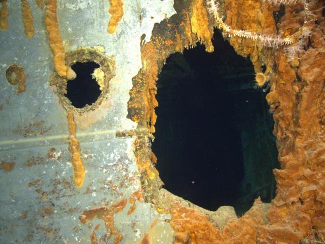 Damage from a contact-fused explosive shell, right, and the hole punched by an armour-piercing shell, left, in HMAS Sydney II’s side.  Picture: WA Museum and Curtin University. Copyright WA Museum.