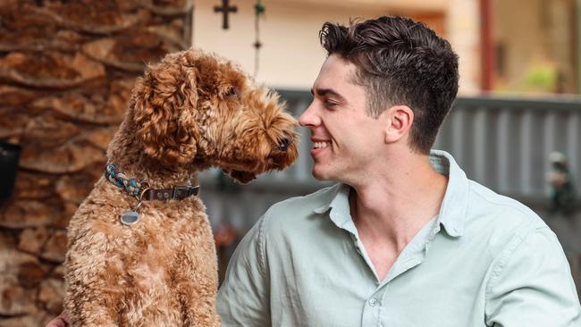 Mix 102.3’s new breakfast host Max Burford and his dog Morris. Picture: Russell Millard