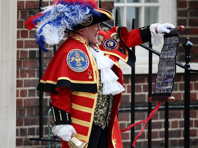 A town crier announces that the Duchess of Cambridge has given birth to a baby boy at St Mary’s Hospital in London on April 23, St George’s Day. Picture: Jack Taylor/Getty Images