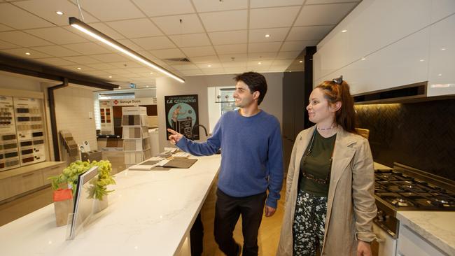 Nathan Burgess and his partner Jess Barry choosing a kitchen at Simonds homes display gallery in Melbourne. Picture: NCA NewsWire / David Geraghty