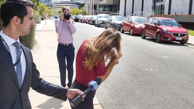 Fraudster bride Claudia Gelonese, 26, was greeted by her husband as she left the ACT Supreme Court. Picture: Craig Dunlop