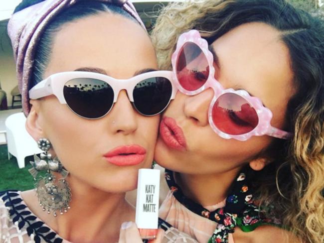 Katy Perry shows off her lippy with a pal at Coachella. Picture: Twitter