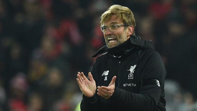 Liverpool's German manager Jurgen Klopp applauds on the touchline.