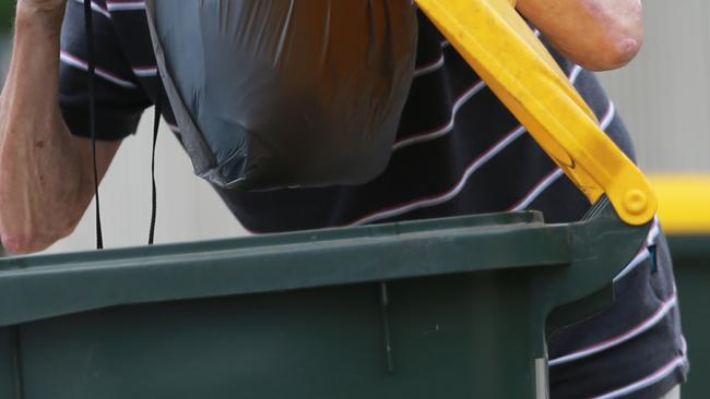 A 61-year-old man was bashed after he was caught going through a wheelie bin to collect cans.