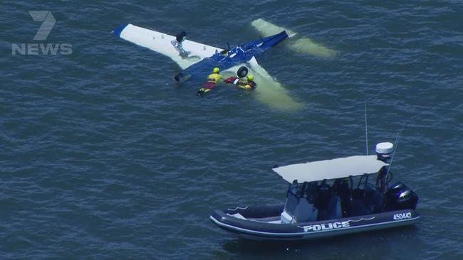 Divers search the wreckage. Picture: 7NEWS Brisbane