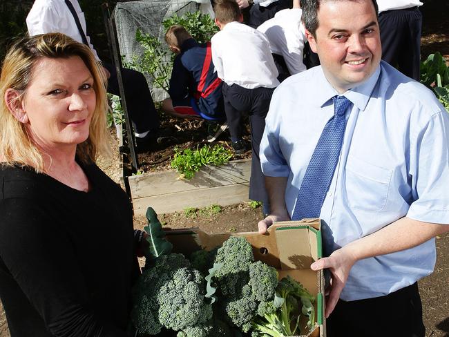 Linda Strickland with teacher Steven Catt and some of the broccoli from the garden.