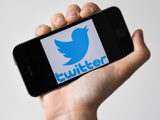 (FILES) In this file photo taken on May 02, 2019 a woman shows a smartphone with the logo of US social network Twitter, in Nantes, western France. - Twitter said March 4, 2020 it is testing a way for users to "think aloud" with tweets that vanish after a day instead of having posts linger. The ability to send ephemeral tweets called "Fleets" is being tried out in Brazil, according to the San Francisco-based social media platform. If more widely implemented, Twitter would match the disappearing posts first made popular by Snapchat and later adopted by Facebook and other platforms. (Photo by LOIC VENANCE / AFP)