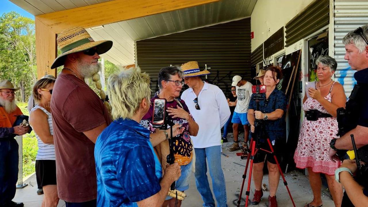 Members of the gathering of people speak to police at the former Tewantin TAFE site. Picture: Supplied