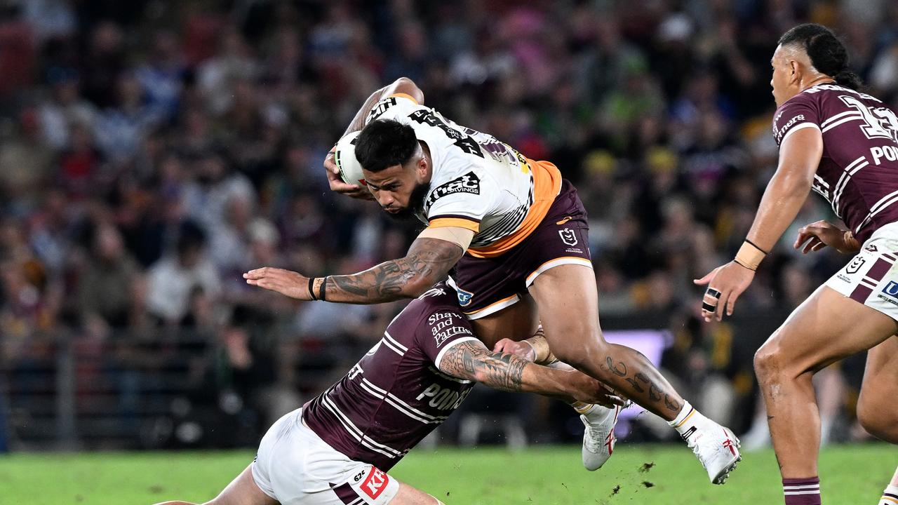 Haas surges through a tackle against the Sea Eagles.