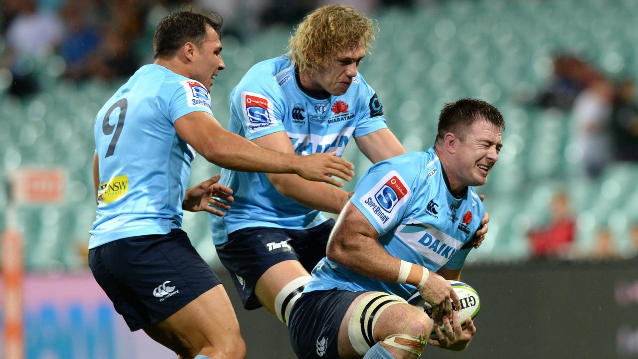 Waratahs forward Jed Holloway scores a try at the SCG.