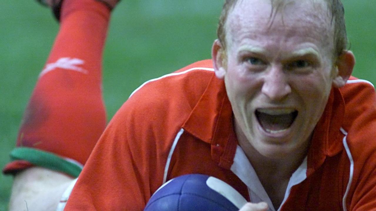 Wales great Neil Jenkins scores a try against France in Paris in 2001.