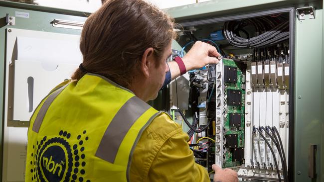 An NBN Co technician installing a fibre-to-the-building connection in Sydney. Photographer: Cole Bennetts/Bloomberg via Getty Images