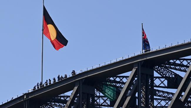 The Aboriginal flag flies over the Sydney Harbour Bridge. Picture: Jeremy Piper/NCA NewsWire