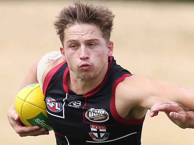 St Kilda training at Moorabbin.  Jack billings fends off assistant coach Aaron Hamill   . Pic: Michael Klein