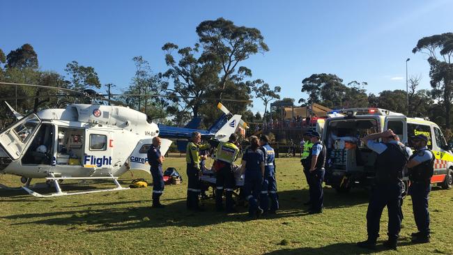 A boy, 11, from Davidson, is taken to The Children's Hospital, Westmead by the CareFlight emergency helicopter, which landed at Frenchs Forest Showground, after he suffered serious head injuries while playing on a trampoline on Father's Day. Picture: CareFlight