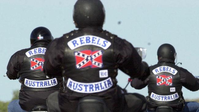 D/I Motor cycle riders Rebel bikie gang members riding leaving Port Augusta on highway one on their way to WA 14 Oct 2000. rebels motorcycle