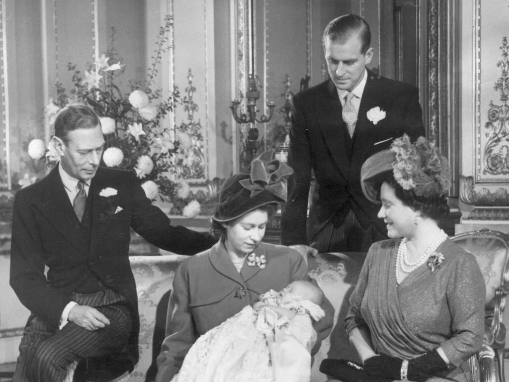 Prince Charles with his parents and grandparents after his christening in 1948. Picture: Supplied