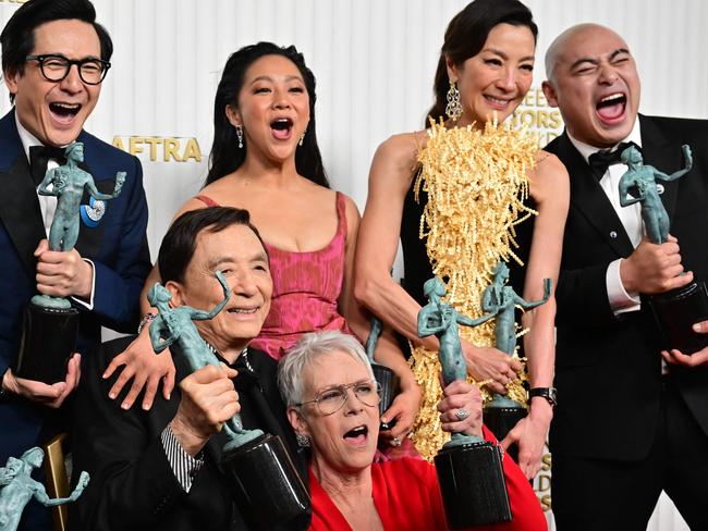 TOPSHOT - Actors Michelle Yeoh, Ke Huy Quan, Stephanie Hsu, Jamie Lee Curtis, James Hong, and cast pose with the award for Outstanding Performance by a Cast in a Motion Picture for "Everything Everywhere All at Once" during the 29th Screen Actors Guild Awards at the Fairmont Century Plaza in Century City, California, on February 26, 2023. (Photo by Frederic J. Brown / AFP)