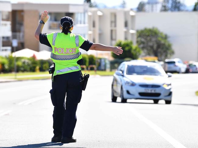 Police conduct travel checks during lockdown at Alexandra Headland. Picture: Patrick Woods.