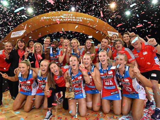 Swifts players celebrate winning the Super Netball Grand Final match between the Sunshine Coast Lightning and the New South Wales Swifts at the Brisbane Entertainment Centre in Brisbane, Sunday, September 15, 2019. (AAP Image/Darren England) NO ARCHIVING, EDITORIAL USE ONLY