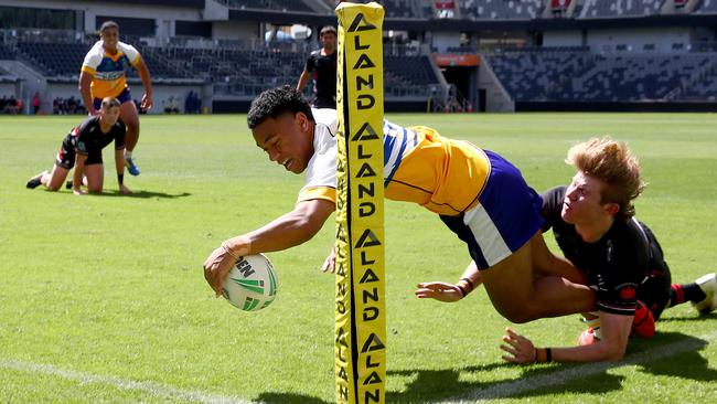 Patrician Brothers’ Sione Lino scores a try to help seal the 32-24 win. Picture: Toby Zerna