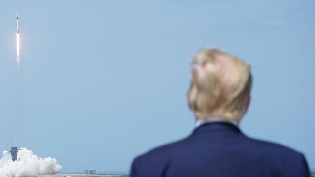 Mr Trump watches the SpaceX Falcon 9 rocket lift off from Kennedy Space Center in Florida on May 30.