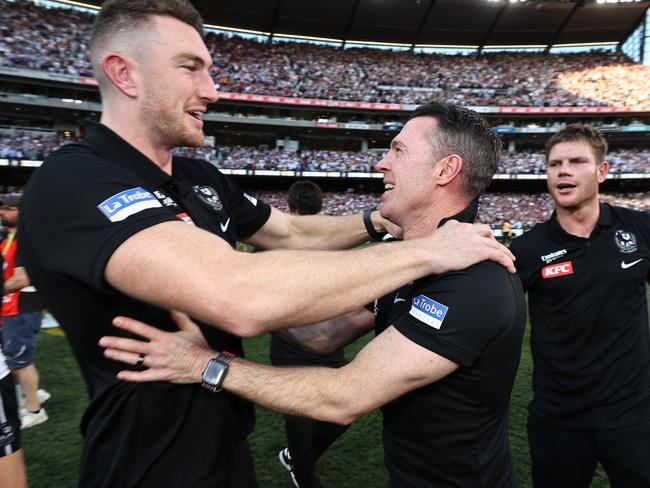 MELBOURNE , AUSTRALIA. September 30, 2023. AFL Grand Final between Collingwood and the Brisbane Lions at the MCG.  Craig Macrae, senior coach of the Magpies with Daniel McStay and Taylor Adams   .Picture by Michael Klein