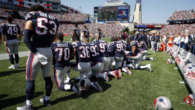 Several New England Patriots players kneel during the national anthem. Picture: AP