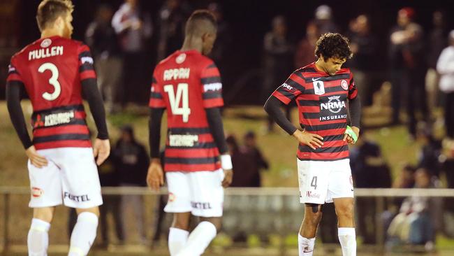 Western Sydney players react to losing to Adelaide City in the 2014 FFA Cup.