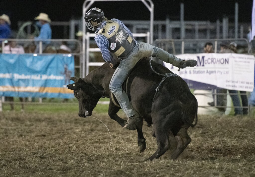 Local Angus Hebblewhite gets turned in the junior steer ride at the Lawrence Twilight Rodeo. Picture: Adam Hourigan