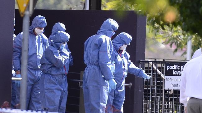 Donna Lee McAvoy is led through the scene at the Pacific Pines Tavern where Detective Sen