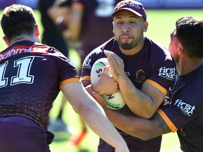 Jamil Hopoate (centre) in action during Brisbane Broncos training.