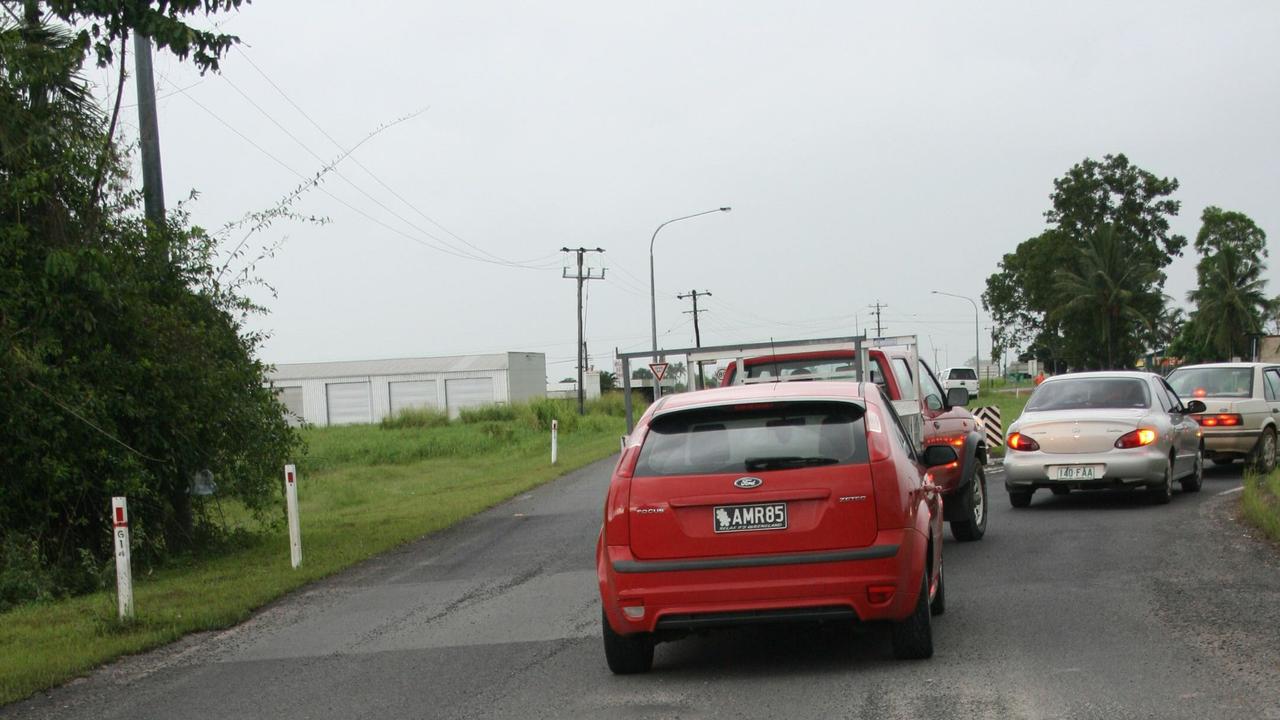 Drivers navigate massive potholes on the Bruce Highway, near Babinda