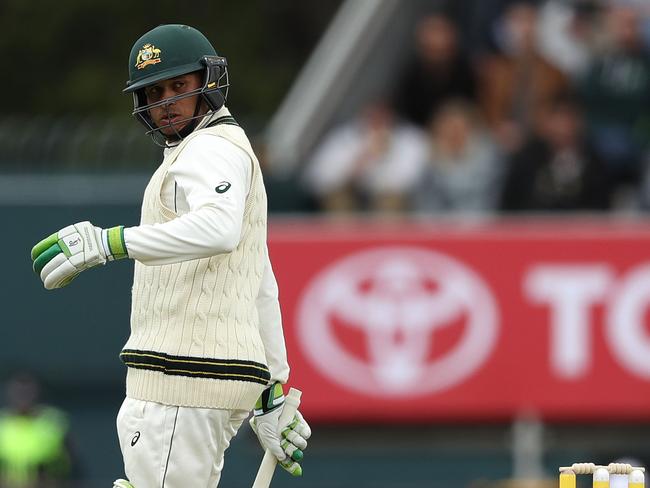 Usman Khawaja watches the ball fall into Hashim Amla’s hands at first slip.