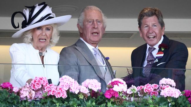 King Charles and Queen Camilla react during a race at Royal Ascot on Friday with leading bloodstock adviser John Warren. Picture: Henry Nicholls / AFP