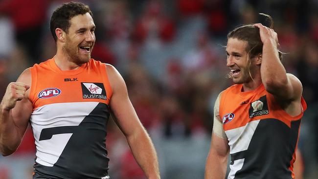 Shane Mumford celebrates with captain Callan Ward after Giants’ historic win. Picture. Phil Hillyard