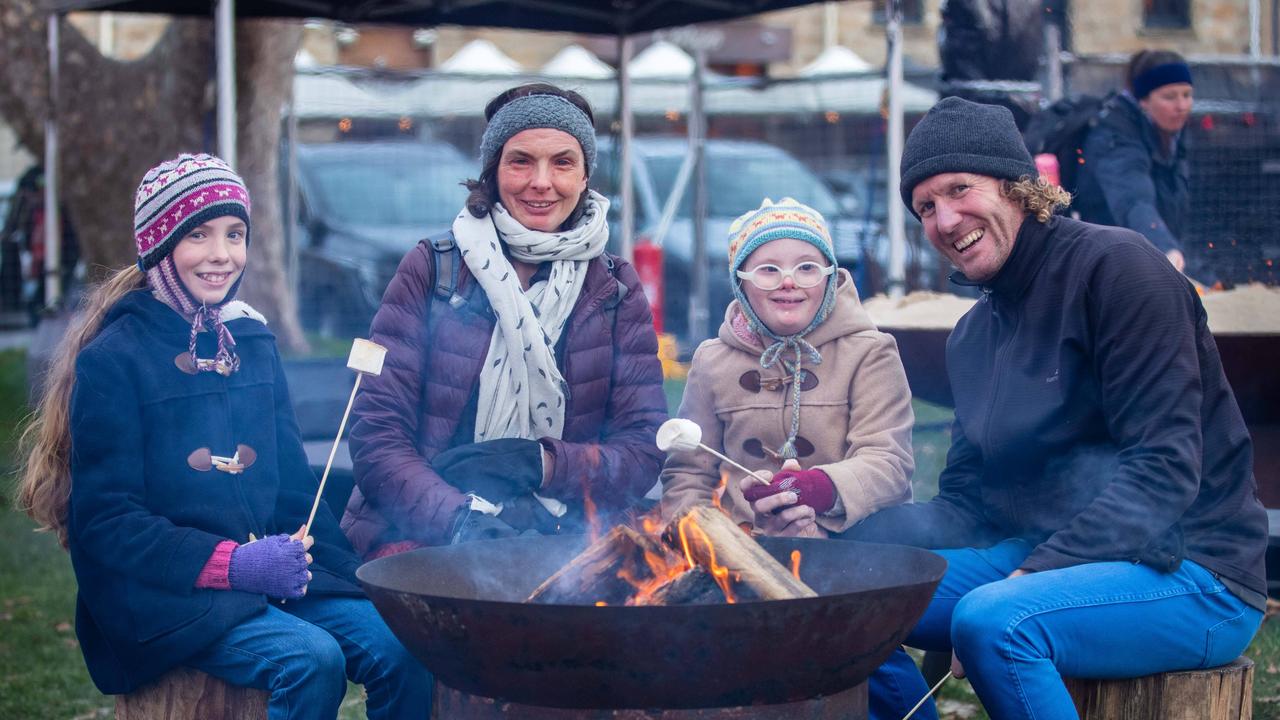 Hobart Family Dani and Mark Hinder with daughters Grace and Amelie, aged 10 toasting marshmallows at the City of Hobart Winter Feast sensory session. Picture: Linda Higginson