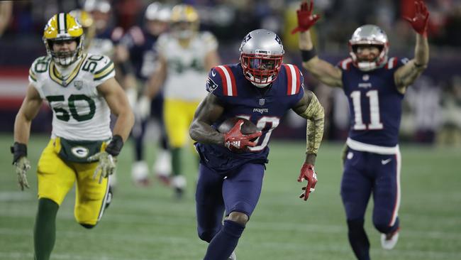 New England Patriots wide receiver Josh Gordon (10) runs from Green Bay Packers linebacker Blake Martinez (50) for a touchdown after catching a pass during the second half of an NFL football game, Sunday, Nov. 4, 2018, in Foxborough, Mass. (AP Photo/Charles Krupa)