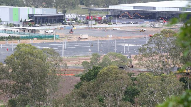 The Rheinmetall factory takes shape in the foreground of the existing industrial estate. (AAP Image/Jono Searle)