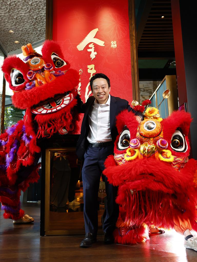 Billy Wong at his restaurant, Golden Century, at Crown Sydney with some lion dancers ahead of Chinese New Year. Picture: Jonathan Ng