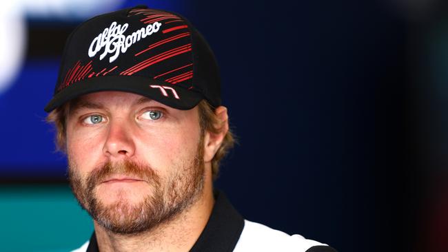 SUZUKA, JAPAN - OCTOBER 06: Valtteri Bottas of Finland and Alfa Romeo F1 talks to the media in the Paddock during previews ahead of the F1 Grand Prix of Japan at Suzuka International Racing Course on October 06, 2022 in Suzuka, Japan. (Photo by Mark Thompson/Getty Images )