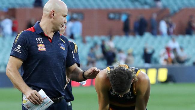 Matthew Nicks consoles a dejected Jake Soligo post-match. Picture: Sarah Reed/AFL Photos via Getty Images