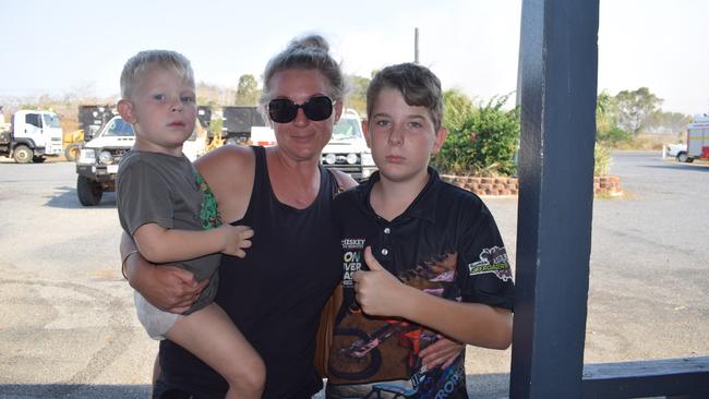 Ebony Gillies and her children Steele and Hawken at the Kabra Pub as the fire threatened her property at Stanwell.