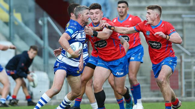 Jarrod Boyle looking to escape a tackle. Picture: Denis Ivaneza