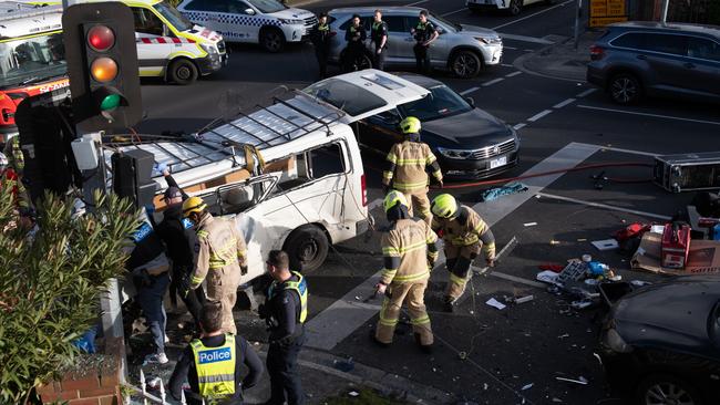 Police at the scene on Alma Rd after the fleeing van crashed into another car. Picture: Supplied/ Chris Phutully