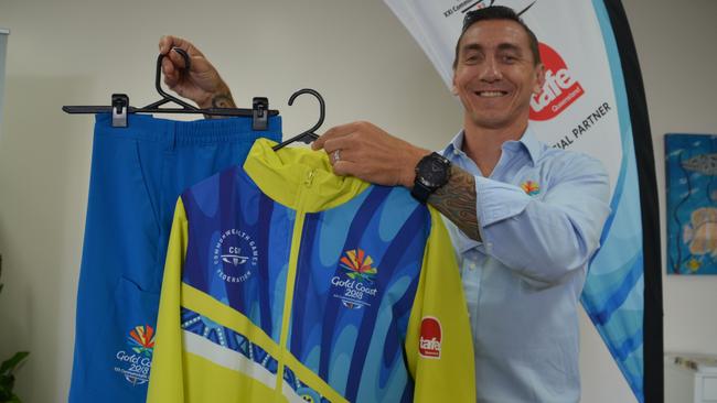 Mat Rogers presents the uniform which will be worn by volunteers in Townsville for the 2018 Commonwealth Games. Photo Andrew Backhouse