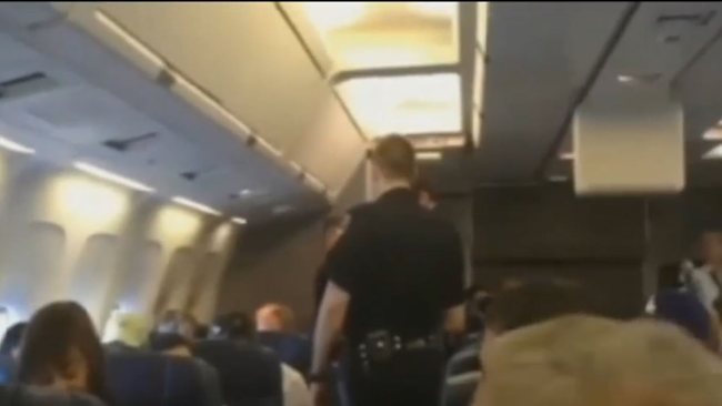 Woman kicked off plane for singing