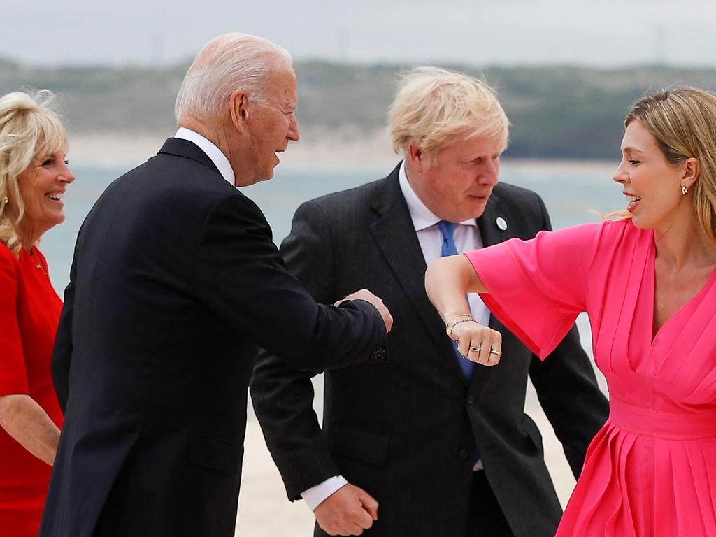 Britain's Prime Minister Boris Johnson (2R) and his spouse Carrie Johnson (R) greet US President Joe Biden (2L) and first lady Jill Biden during the G7 summit in Carbis Bay, Cornwall.